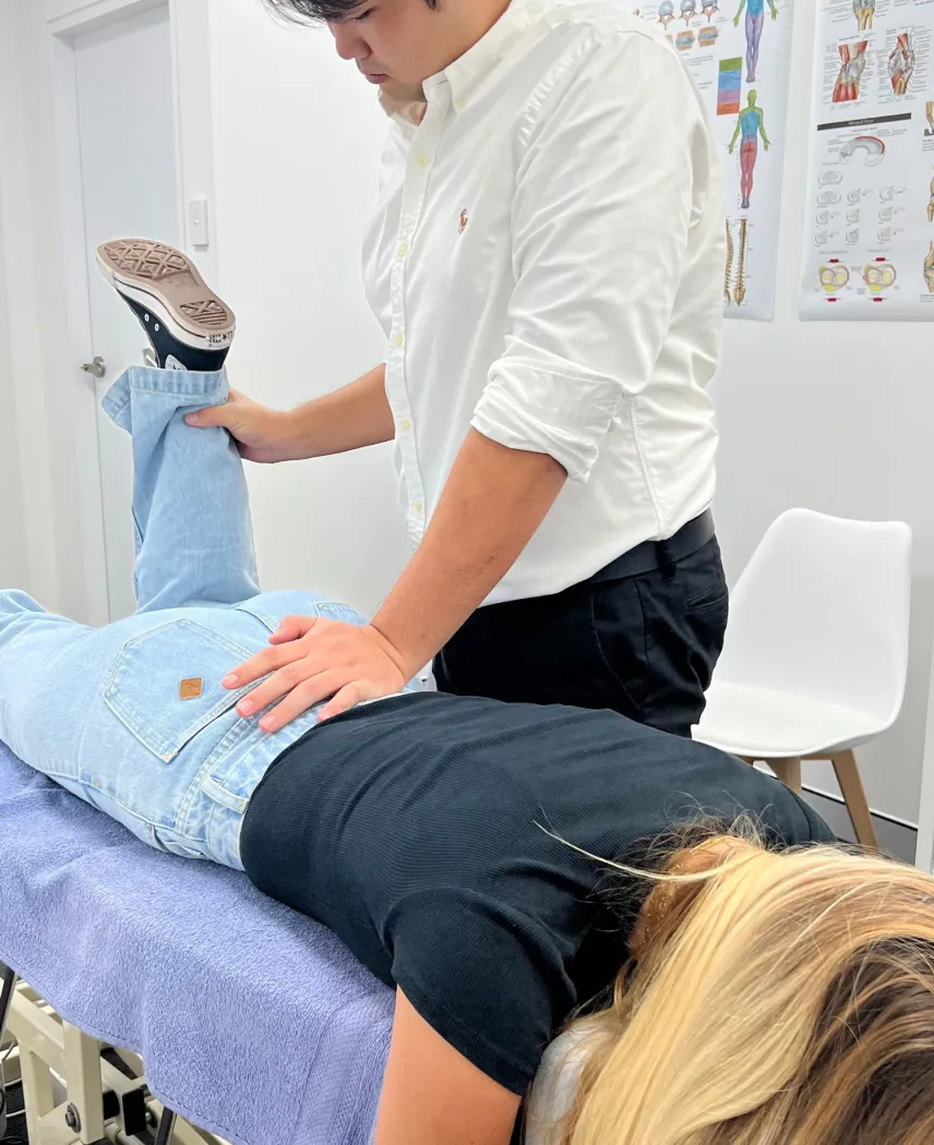 Chiropractor treating a patient with lower back pain